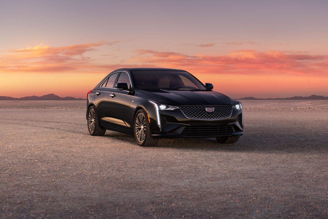Three Quarters Front View of a Black 2026 CT4 Parked in the Open Desert