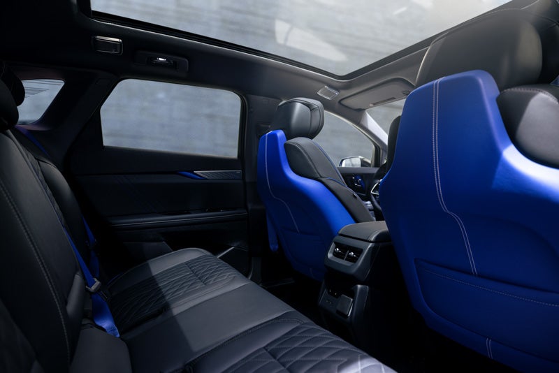 Back Seat View of the 2026 OPTIQ-V Blue Front Seats, Sun Roof, and Interior | Stephen Cadillac in Bristol CT